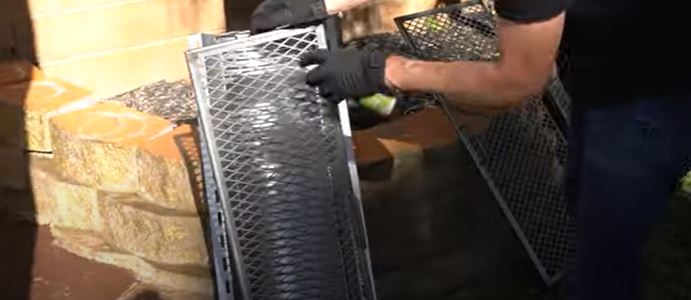 applying oil on smoker and its parts